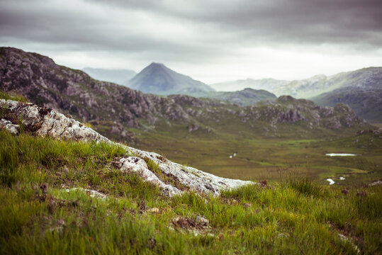 Dramatic landscape of light and cloud over mountains in scotland - Powered by Adobe