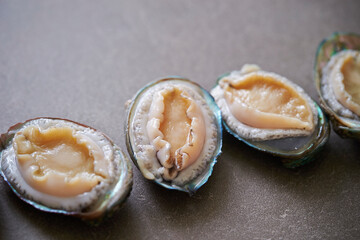 Raw abalone washed clean on marble 