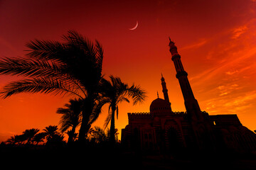 Beautiful large Islamic mosque at the sunset sky background
