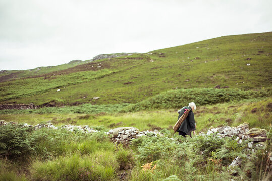 women alone with ruins in green mountains