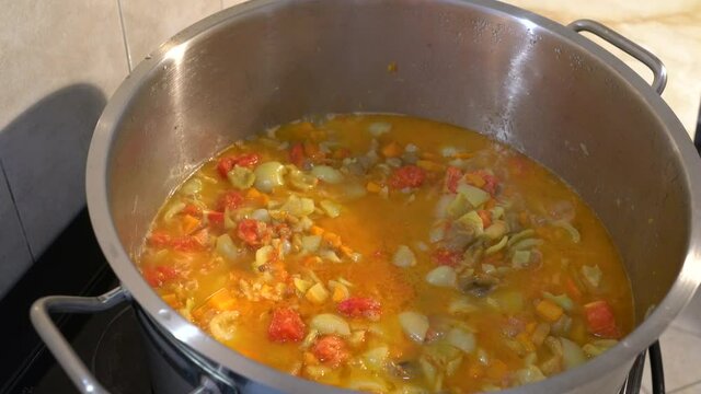 Cooking homemade G&uuml;ve&ccedil; in pot - (4K)