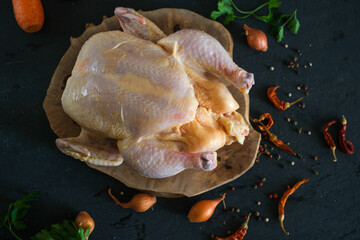 Raw whole chicken with ingredient