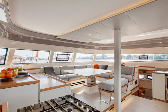 Galley & main saloon inside a catamaran cruising on the Garonne river