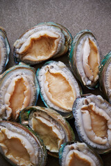 Raw abalone washed clean on marble 