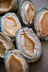 Raw abalone washed clean on marble 