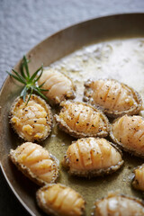 Grilled fresh abalone on a cast iron pan