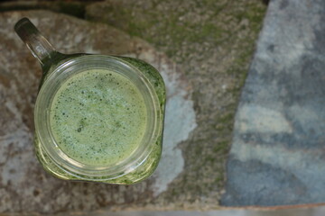 green detox beverage closeup and selective focus 