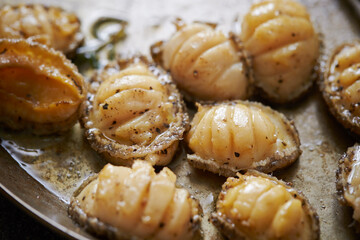 Grilled fresh abalone on a cast iron pan