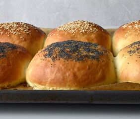 fresh baked buns with sesame and poppy  seeds