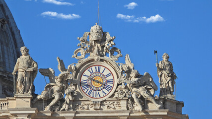 Fototapeta na wymiar Zoom detail photo of main clock in Saint Peter Basilica, Vatican City, Rome, Italy