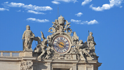Zoom detail photo of main clock in Saint Peter Basilica, Vatican City, Rome, Italy