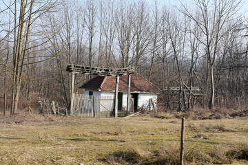 Abandoned building at side of dry brush