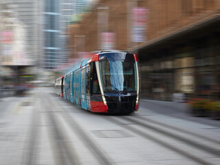Tram moving through George St in Sydney NSW Australia