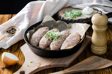 raw lazy cabbage rolls in a cast iron skillet