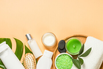 Fototapeta na wymiar Spa wellness background. Treatment and healthcare concept. Natural spa products with bath towels, massage brush and green leaves. Flat lay image.