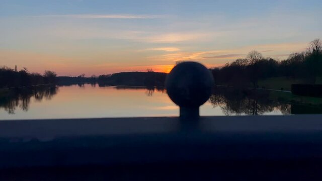Wide Shot Of Bridge over Aasee Lake in Muenster Showing Lake And Sunset - close up