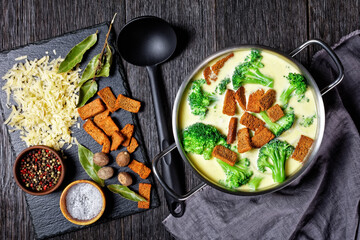 cream soup with broccoli and croutons in a pot