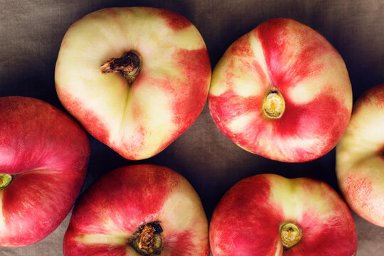 Overhead view of Saturn peaches on table