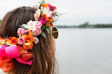 Close-up rear view of teenager wearing artificial flowers