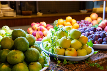 Open buffet full of delicious fruits with orange, grape, watermelon