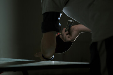 Close-up of man playing table tennis