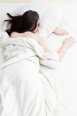 Obraz na płótnie Canvas Lifestyle portrait of cute girl sleeping on bed