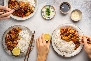 Asian food rice noodle served with chicken in Teriyaki sauce and sesame seeds, top view