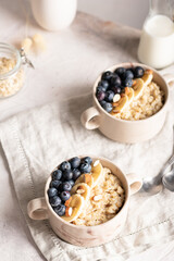 Morning breakfast with oatmeal porridge and blueberries