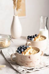 Morning breakfast with oatmeal porridge and blueberries