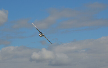 Vintage  PBY-5A Catalina “Miss Pick Up” (G-PBYA) Flying Boat  in Flight. Clouds and Blue Sky.