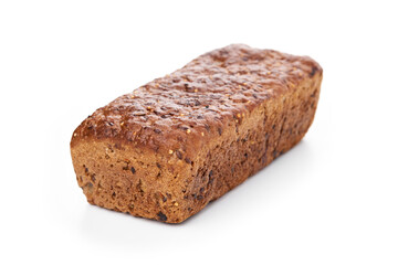 Loaf Of Whole Grain Bread. Detailed close-up of sliced grain bread on white background. Homemade healthy bread. Bakery - gold rustic crusty loaves of bread and buns. Flat lay. Food concept. 