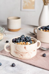 Morning breakfast with oatmeal porridge and blueberries
