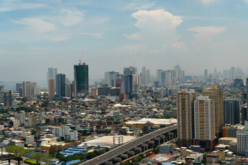 Fototapeta na wymiar Panorama of Manila city. Skyscrapers and business centers in a big city. Travel vacation concept