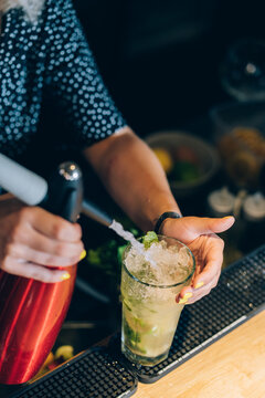 Waitress Preparing A Mojito Cocktail In A Bar.
