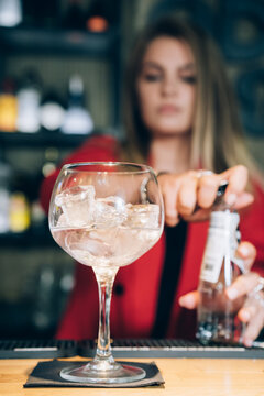 Waitress Preparing A Cocktail In A Bar.