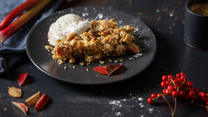 Rhubarb crumble on dark background
