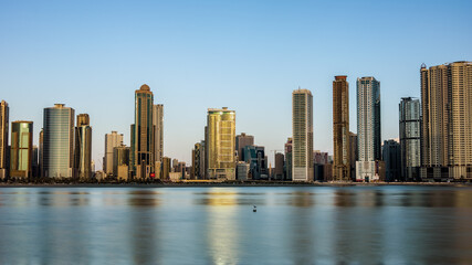 Fototapeta na wymiar Sharjah Cityscape behind alkhan lake.