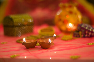 Close-up of diyas on table during Diwali