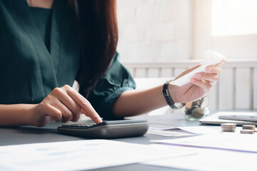 Accountant or banker calculate the cash bill.