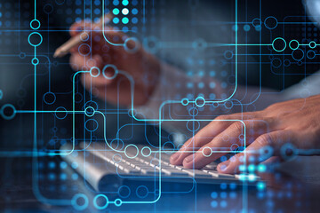 Hands typing the keyboard to create innovative software to change the world and provide a completely new service. Close up shot. Hologram tech graphs. Concept of Dev team. Formal wear.