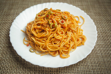 Delicious spaghetti served on a white plate