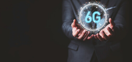 Businessman holding virtual world with connection line and 6G for technology transformation and innovation concept.