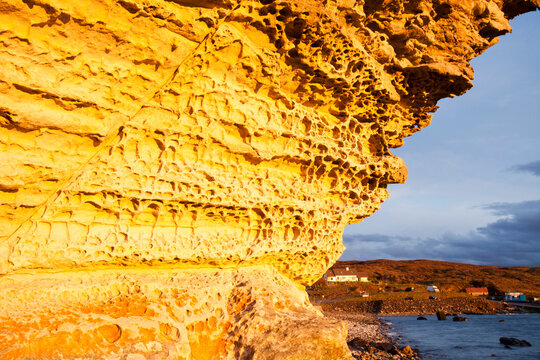 Sunset light on sea cliffs at Elgol, Isle of Skye, Scotland, UK.