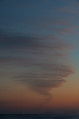twirly cloud over the sea