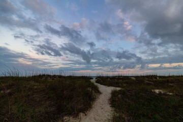 colorful sky over a beach walkway