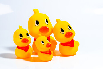 Yellow Rubber Ducks family. Little ducky and mother duck isolated on white background.