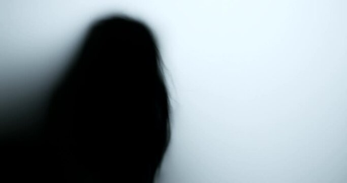 Silhouette of a zombie hand on white background
