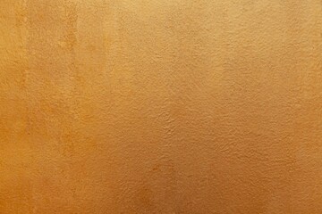 Golden paper with a rough texture and background seamless