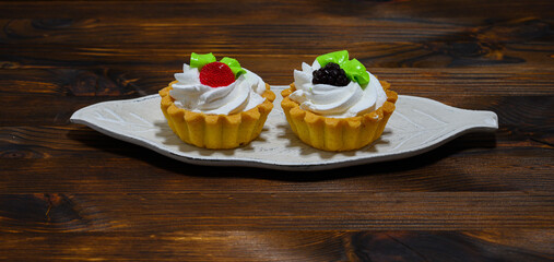 Two baskets of cream on a sheet