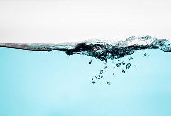water wave with bubbles on white background. Water splash isolated on the white background.